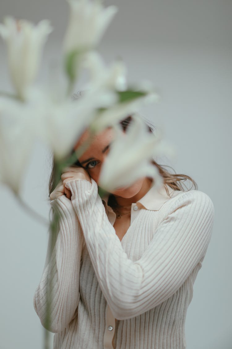 Woman Behind White Flowers