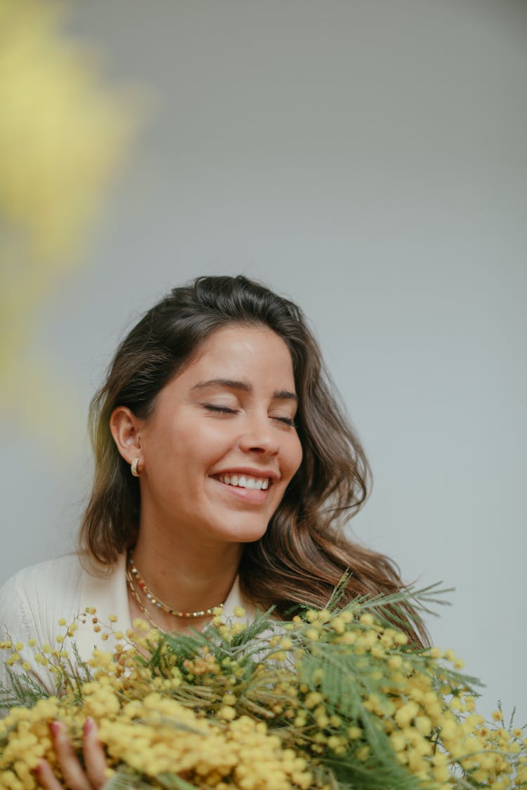 A Woman Holding Flowers