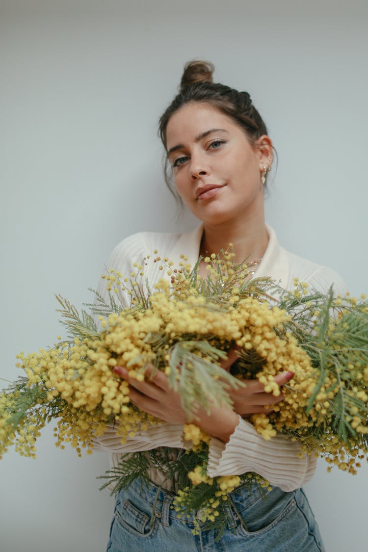 A Woman Holding Flowers 