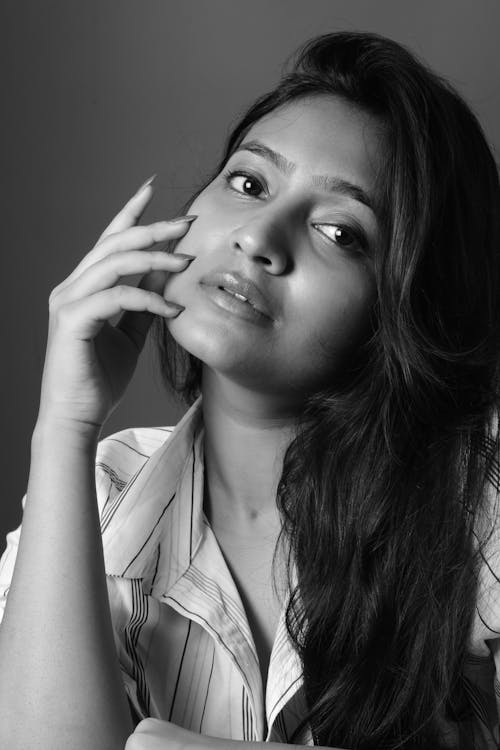 Woman in White and Gray Stripe Button Up Shirt