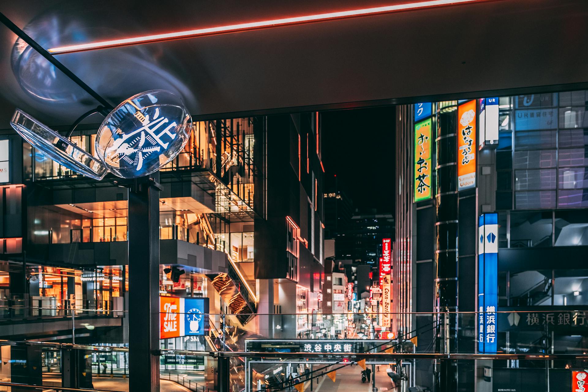 Picturesque cityscape with contemporary buildings with colorful neon signboards and monitors in downtown of Tokyo at night