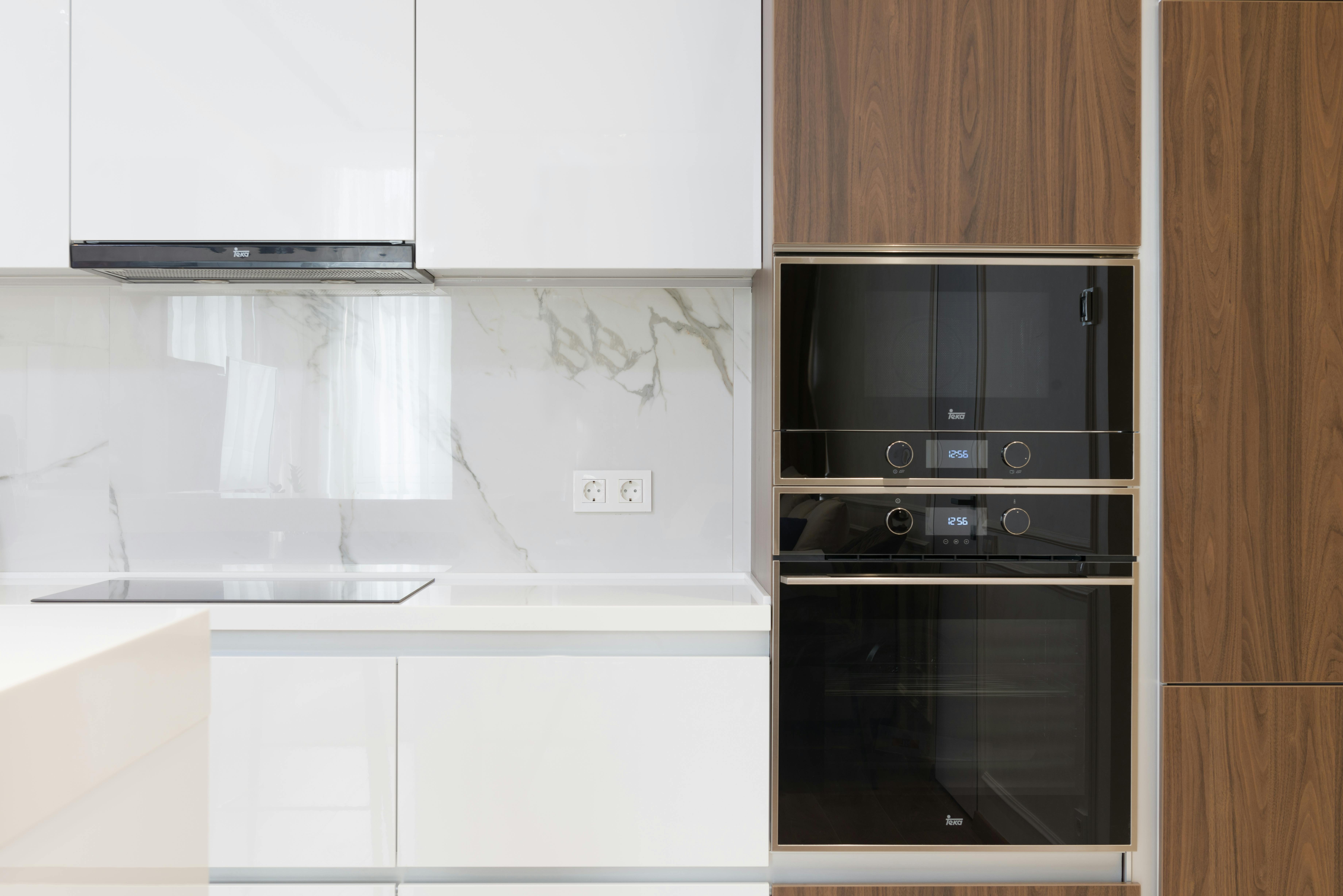 interior of modern kitchen with furniture and electric devices