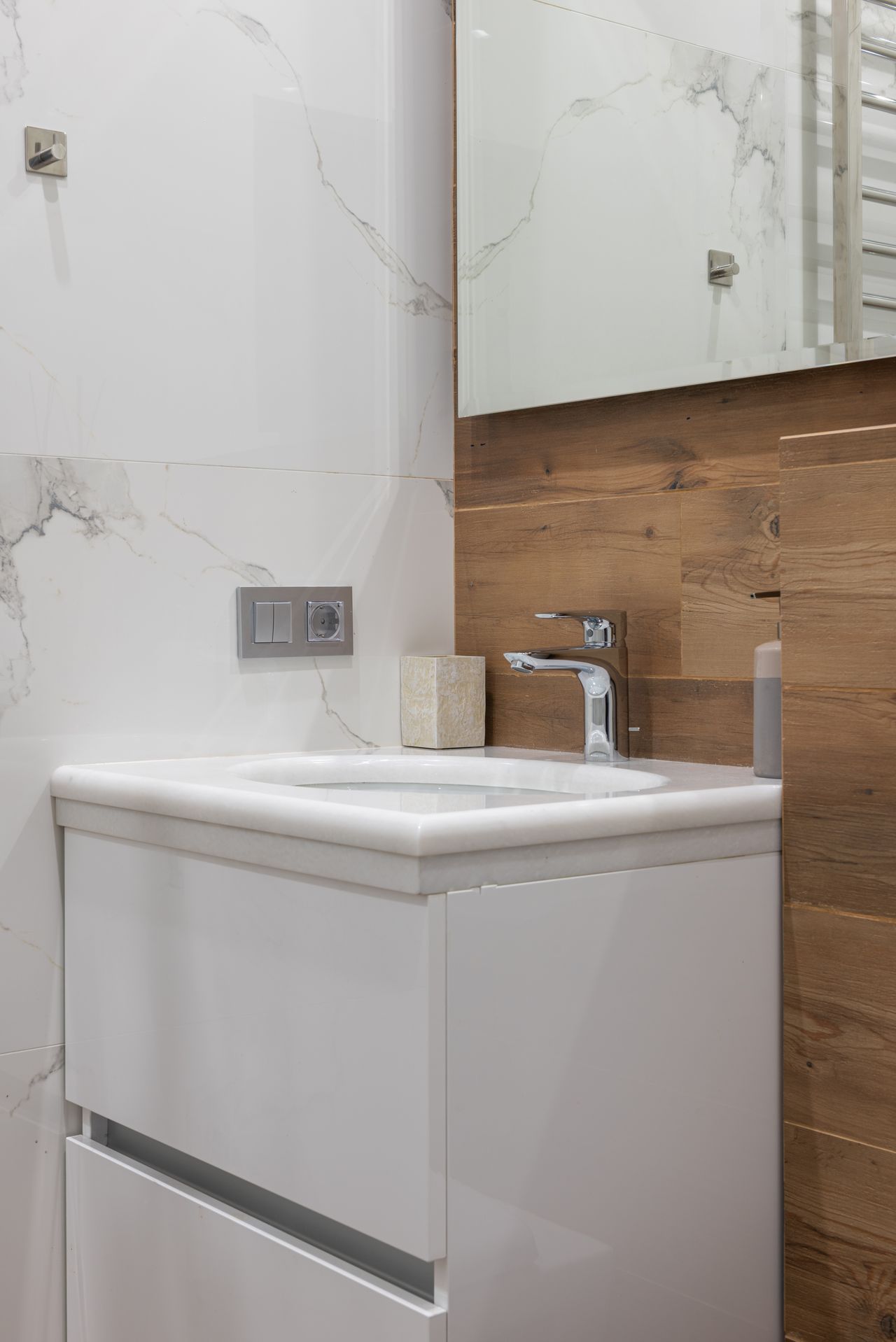 small-corner-bathroom-vanity Compact white vanity in a small modern bathroom