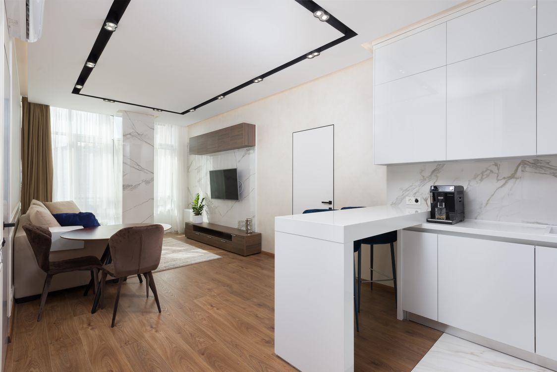 Minimalist interior of modern apartment with kitchen and living room ...