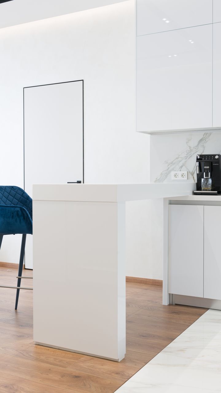warm recessed LED lights installed in a kitchen cabinet above a coffee bar