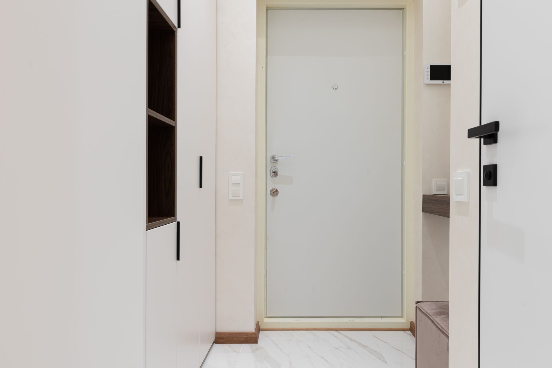 Stylish and minimalist entryway with sleek design and modern furnishings.