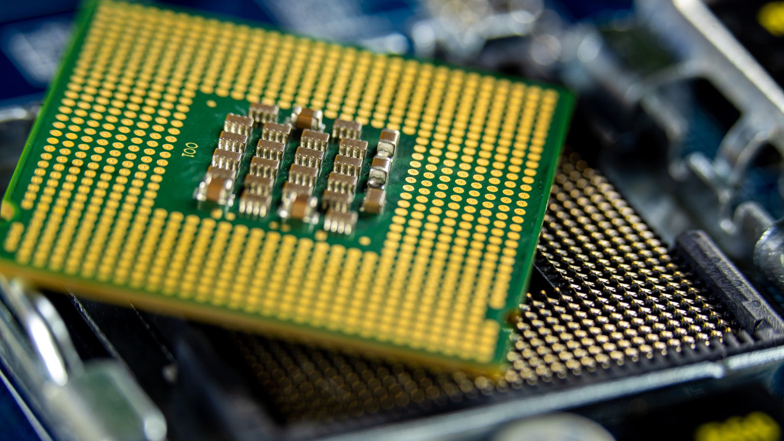 Close-up of a microprocessor seated on a motherboard, an illustrative real photo for the Valorant used-CPU hardware ban story