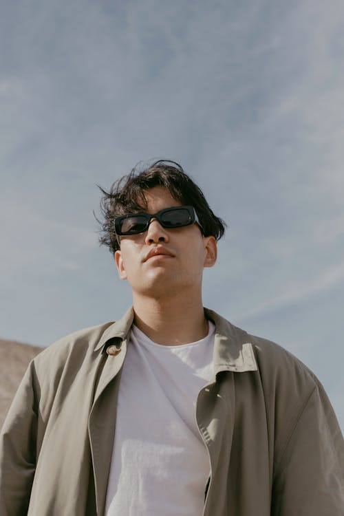 Man in Gray Button Up Shirt Wearing Black Sunglasses