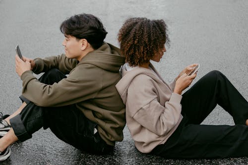 Free People Sitting On The Ground Stock Photo