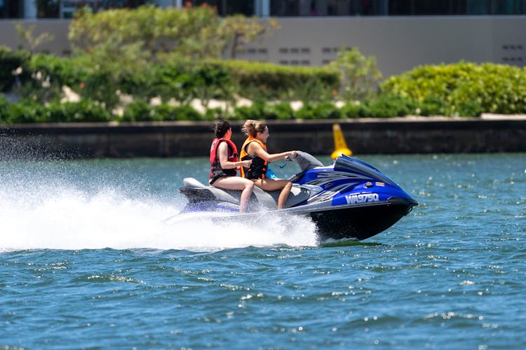 Women Riding A Jetski 