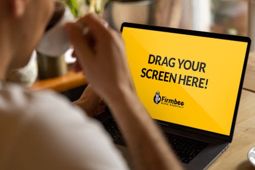 Free Man Using Laptop With A Website On Screen  Stock Photo
