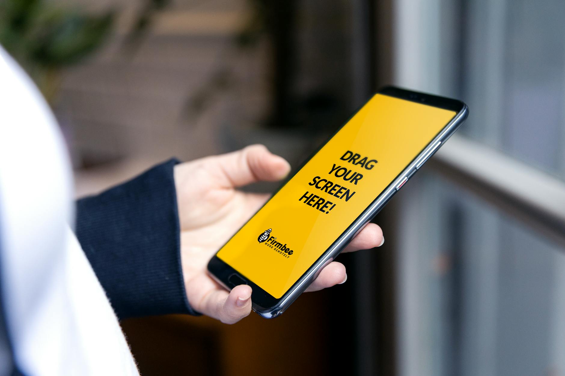 Person Using A Smartphone With An Open Application On Screen