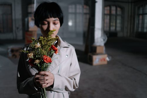 Woman Smelling Flowers