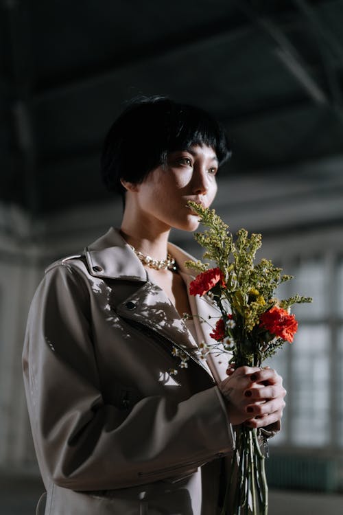 A Woman Holding a Bouquet of Flowers