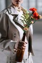 Person Holding Bouquet of Flowers