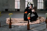 Man Wearing A Helmet Surrounded With Flowers
