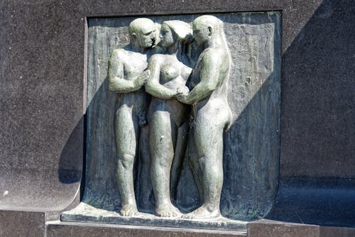 Figurine of Naked Woman Accompanied by Two Nude Men