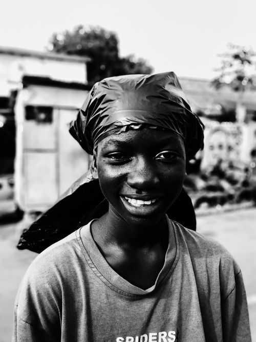 Free Black and white portrait of a young man smiling in Accra, Ghana. Stock Photo