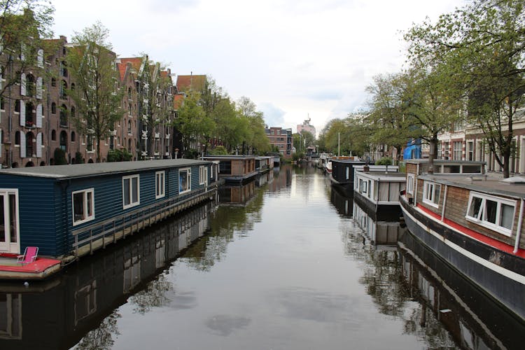 Barges On Water In City Canal