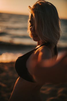 Serene portrait of a woman enjoying the beach during sunset in Vietnam.