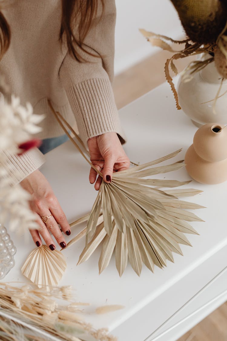 Woman With Dry Plants Making Decoration