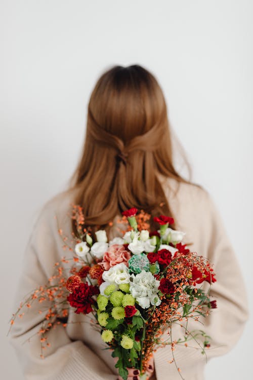 Woman Holding Flowers Bouquet