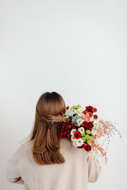 Woman with Flowers Bouquet on White Background