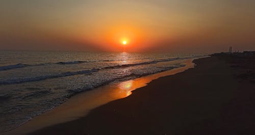 Foto profissional grátis de areia do mar, de frente para o mar, golden sun