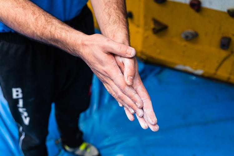 Climber Preparing For Climbing Training In Gym