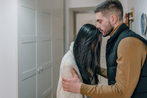 A Man Holding a Woman's Arms