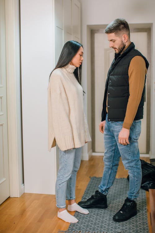 Photo of a Couple Standing Near Each Other