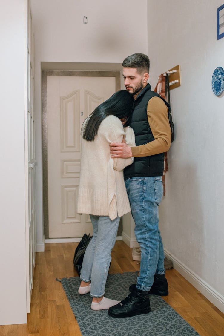 Woman Leaning On A Man While Crying