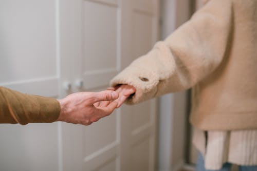 A Couple's Hands Breaking Apart