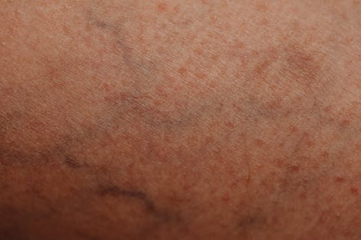 Detailed close-up of human skin with visible texture and veins, showcasing natural patterns.