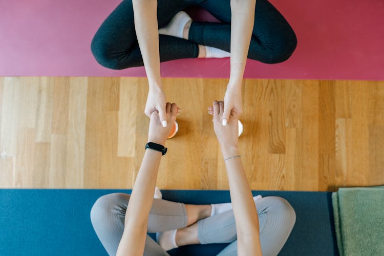 Overhead Shot Of People Holding Hands 