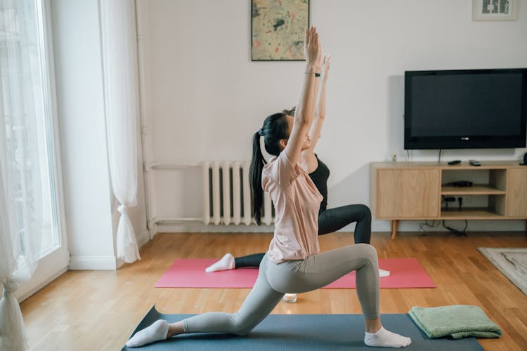 Women Doing Yoga At Home