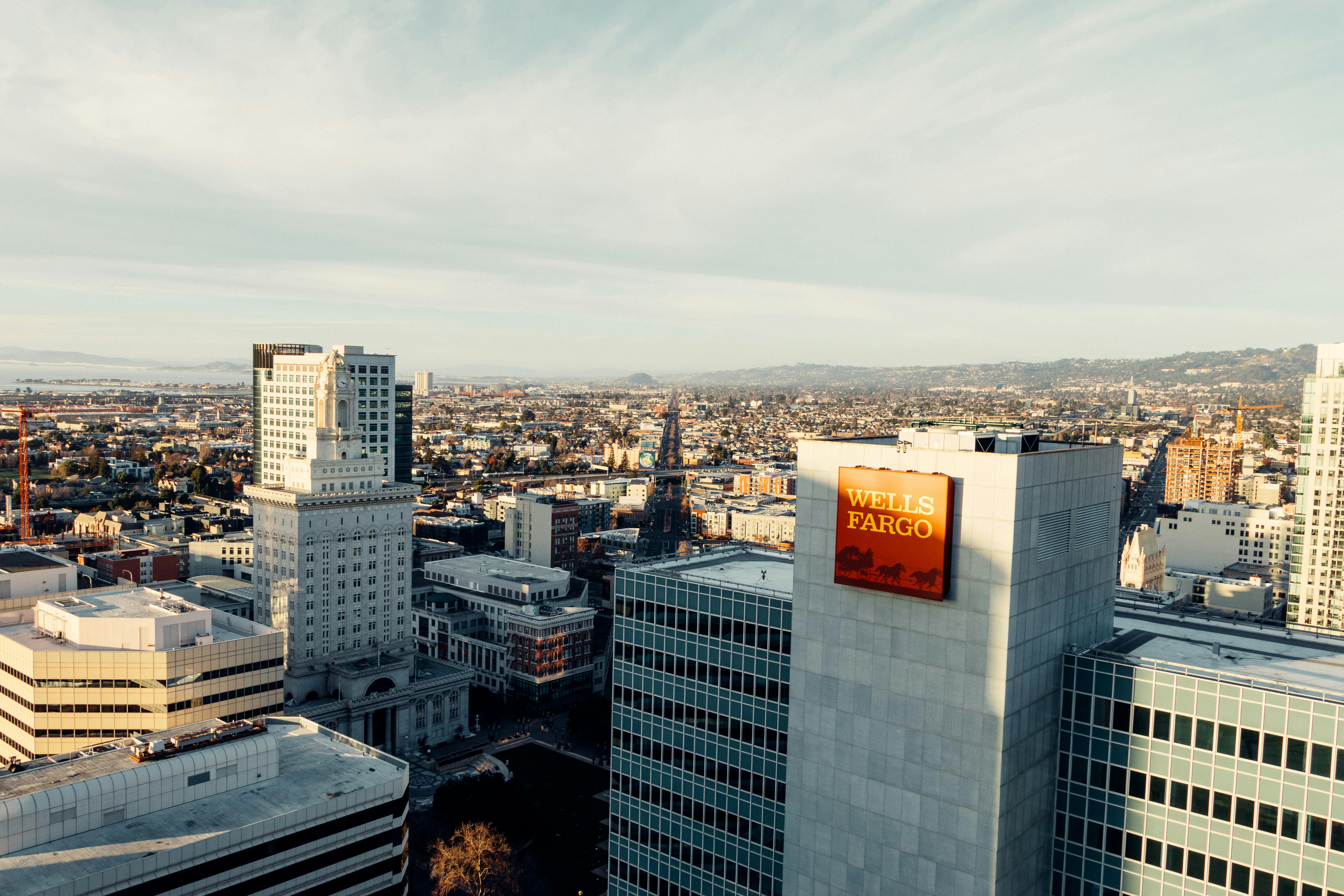 Aerial view of Oakland cityscape featuring Wells Fargo building and urban skyline.