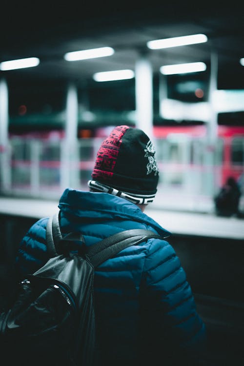 Person Standing on Train Platform