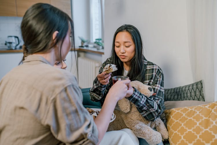 Photo Of Women Eating Cookies Together