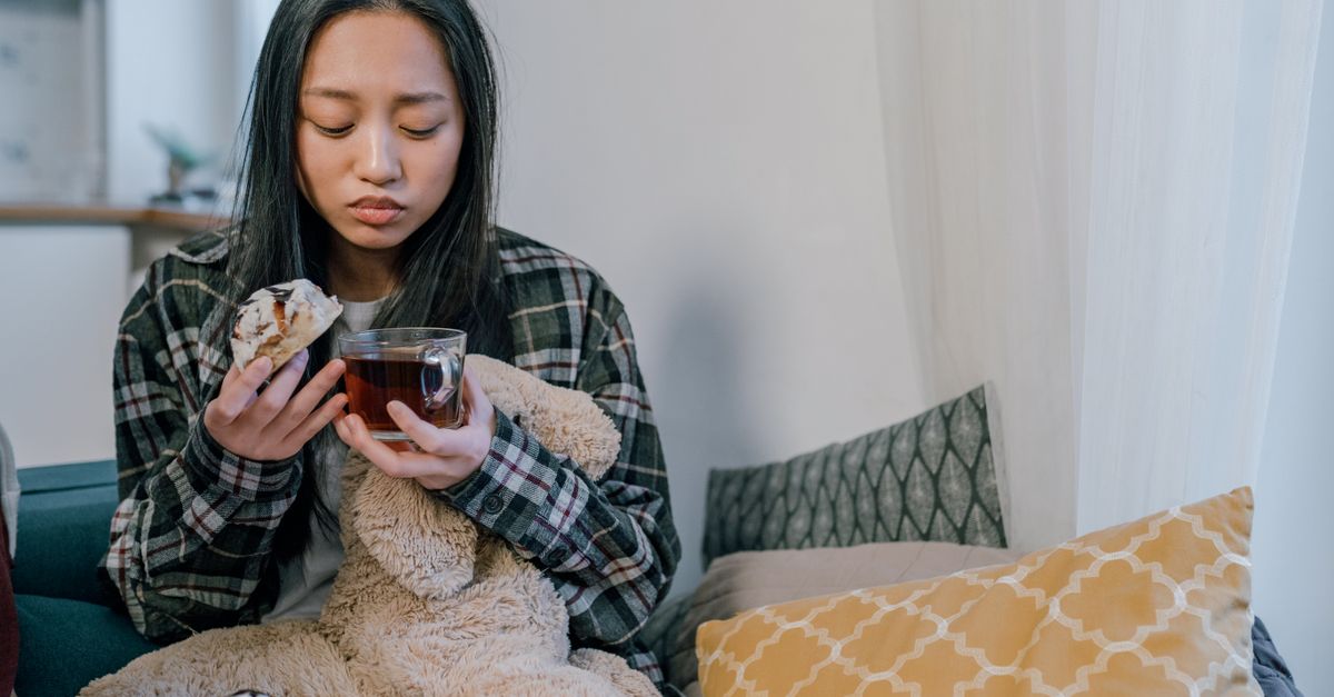 Sad Making Tea Sad Woman Holding a Cup of Tea and Bread · Free Stock Photo