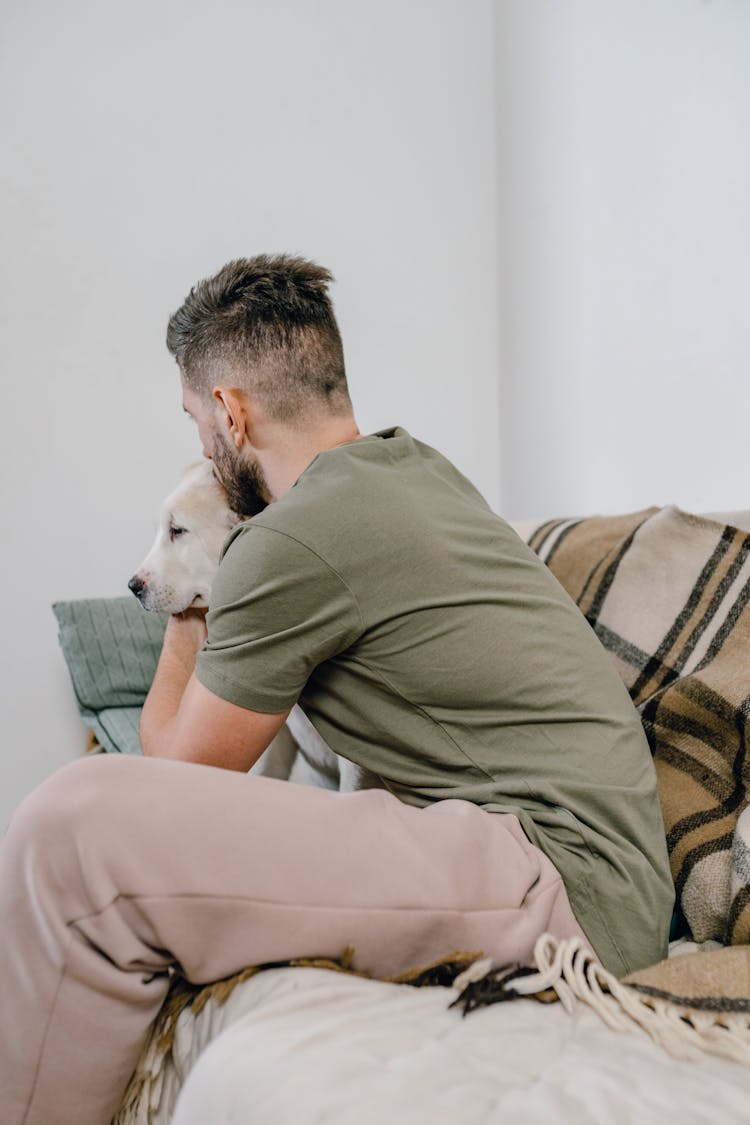 Man Kissing A Dog