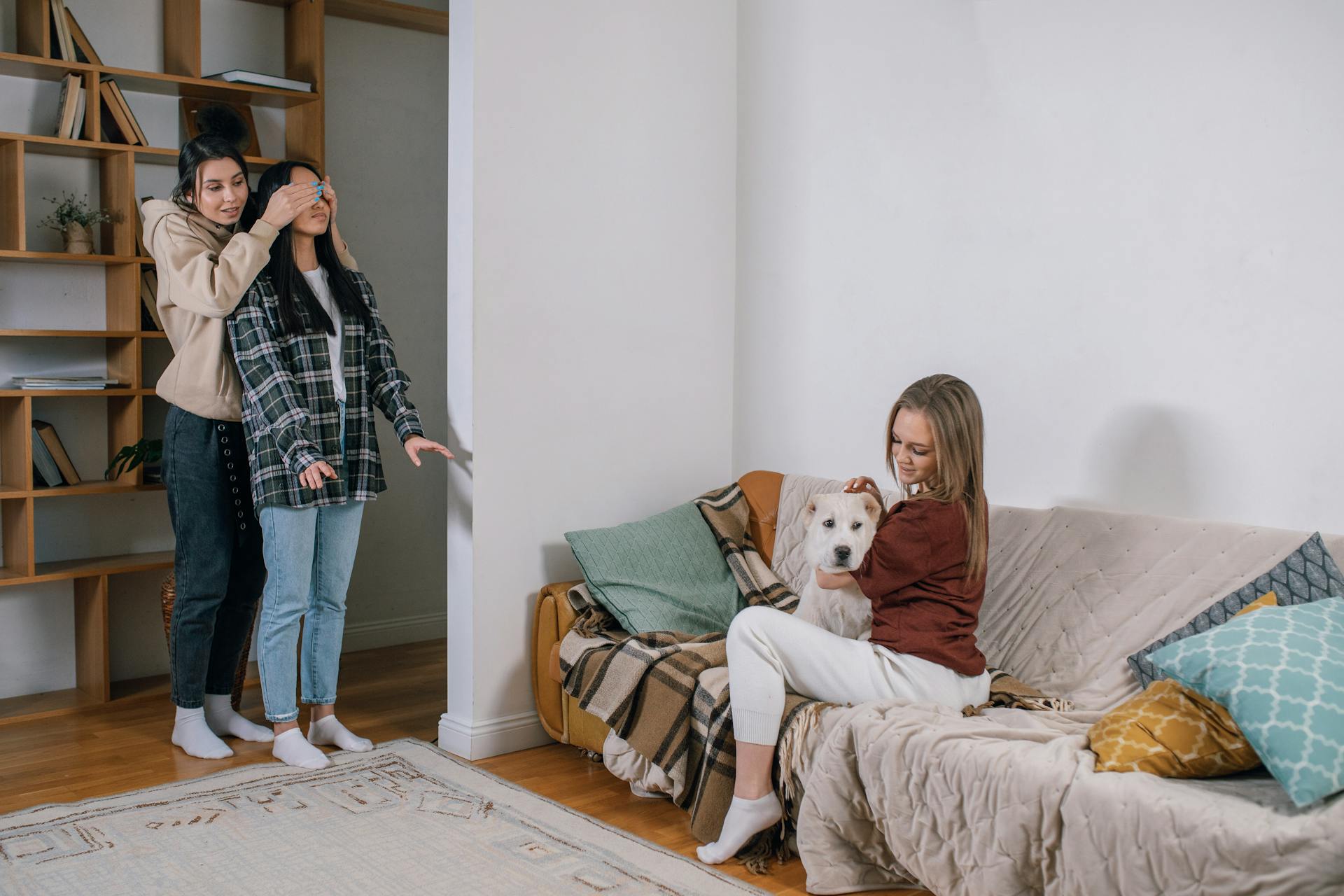 Photo of Women Surprising Their Friend with a Dog