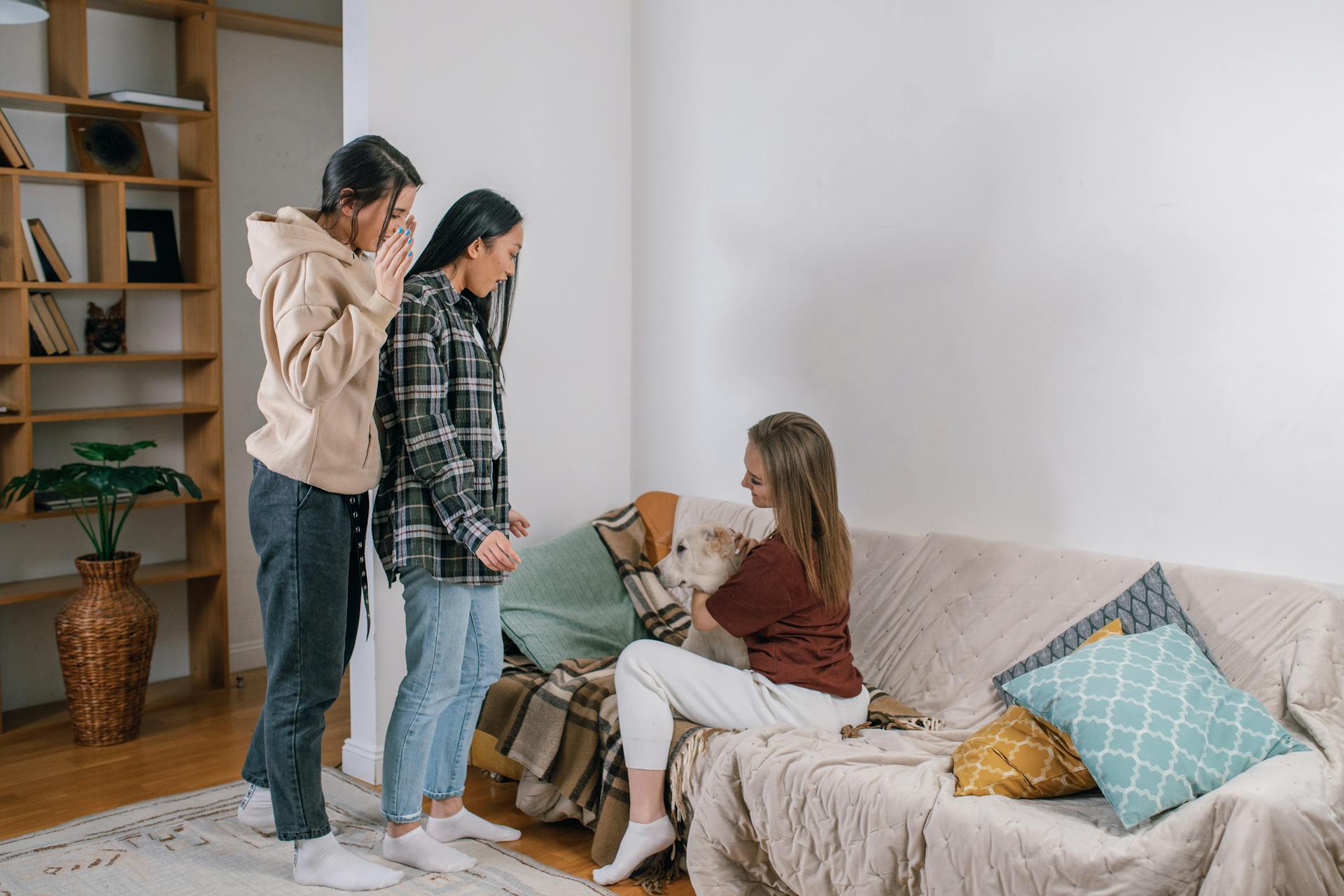 A Woman Petting a Dog Near Her Friends