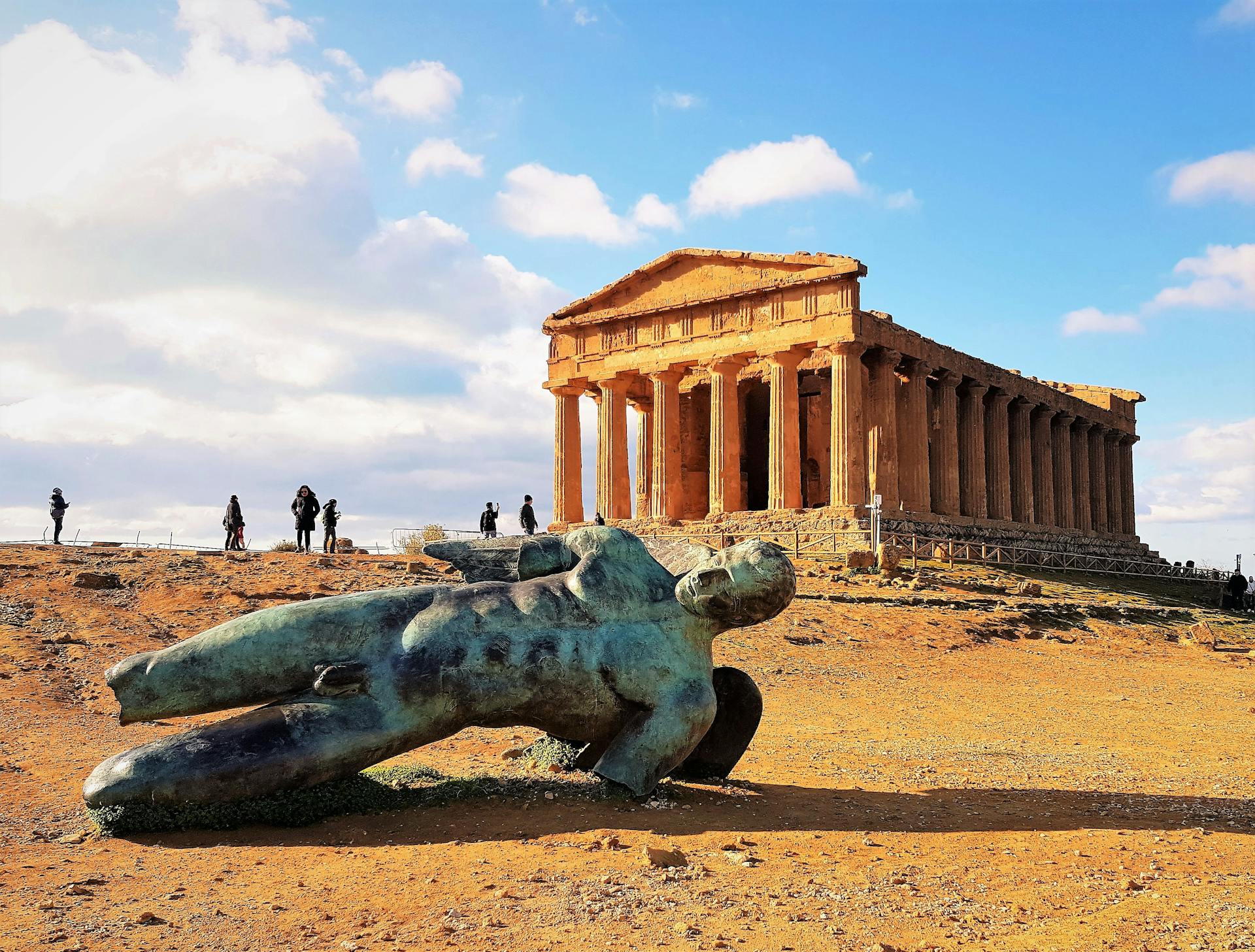 A Statue beside a Concrete Acropolis