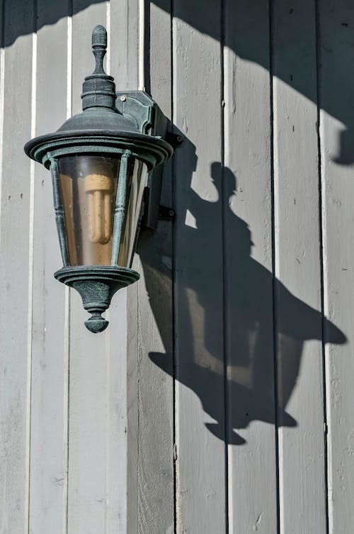 Free A Black Sconce Lamp on the Wall Stock Photo