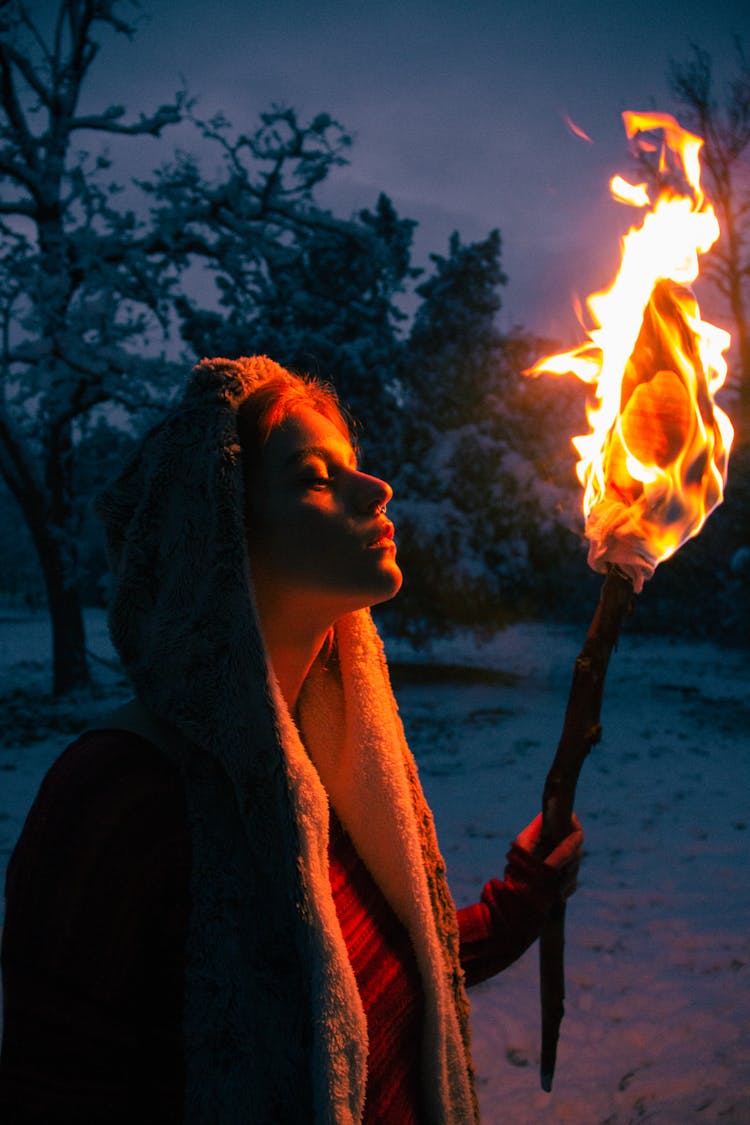 A Woman Holding A Torch