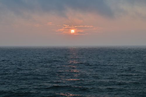 Free Experience the tranquility of a sunset over Lake Michigan with calm waters and peaceful skies. Stock Photo