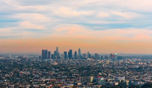 Free A breathtaking aerial view of downtown Los Angeles skyline at sunset, displaying urban architecture and vibrant colors. Stock Photo