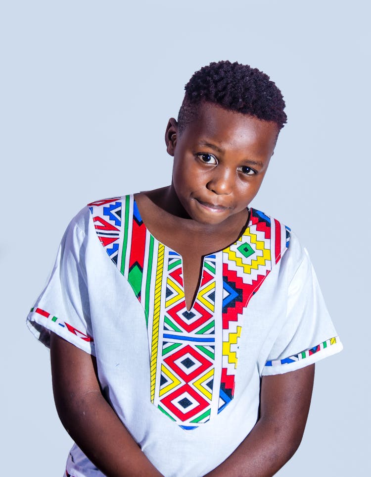 Black Teen In National Shirt With Colorful Ornament