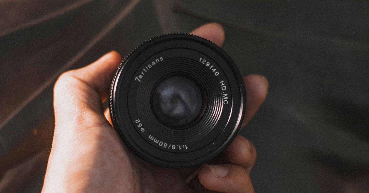 Face Less Lens Faceless photographer showing photo camera lens against leaf · Free ...